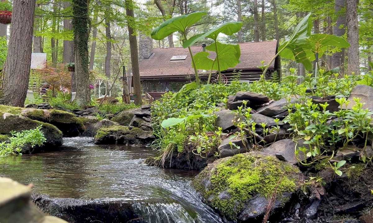 East Stroudsburg Cabin | Rustic Rest Log Cabin, with hot tub and stream, near Poconos attractions.