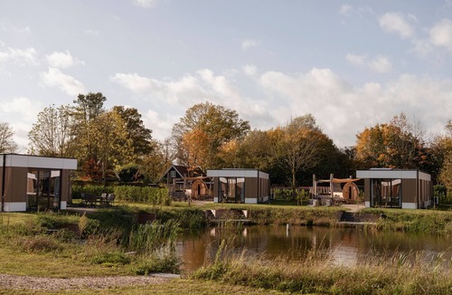 Kotten House | Waterlodge with outdoor sauna and hot tub for 6 guests, offering space and privacy by the water with a private jetty in the Achterhoek.ek.