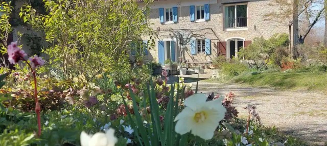 A charming stone house set in a hillside garden in Emilia-Romagna