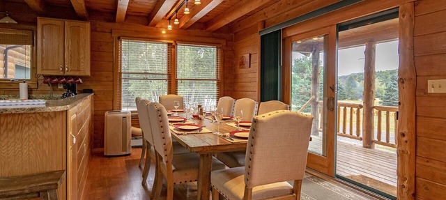 Cedar Log Home sits on 41.87 private acres with mountain and meadow views in Wilmington