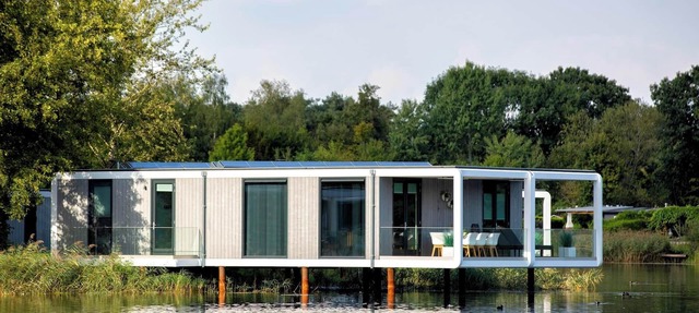 Exclusive water cube with wine climate cabinet three bathrooms and a terrace extending impressively over the water. in Maasbree