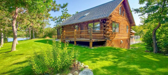 Pristine Log Cabin on 600' of Lake Shore. in Bagley