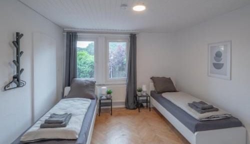 WORK&SLEEP - moderne Apartments mit Einzelbetten, TV, WLAN, Bettwäsche und Handtücher in Oberndorf
